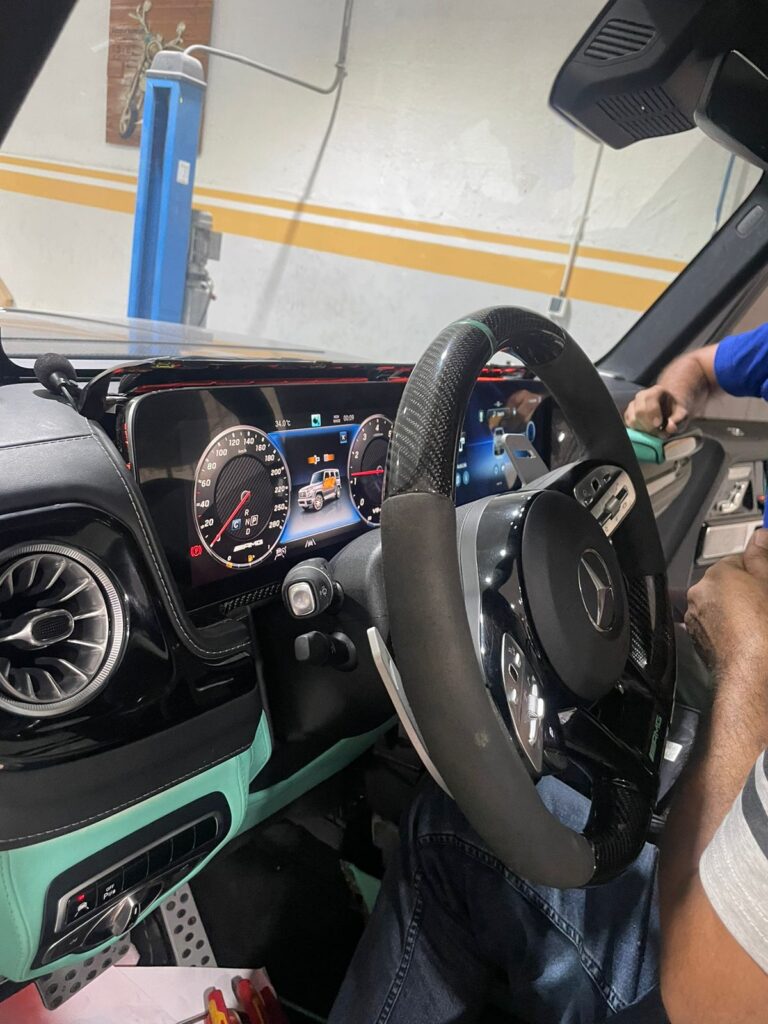 2022 Mercedes G63 screen upgrade installation in progress at Weiss Auto Concept workshop in Dubai