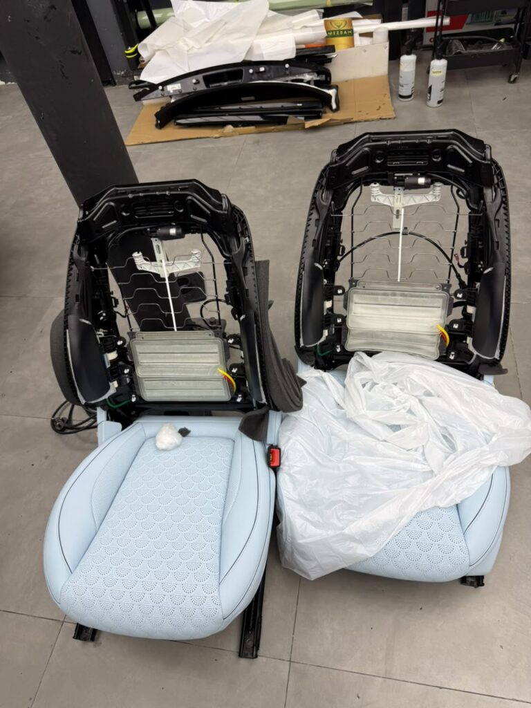 G63 front seats fully disassembled to install OEM headrest monitor brackets in Dubai by Weiss Auto Concept