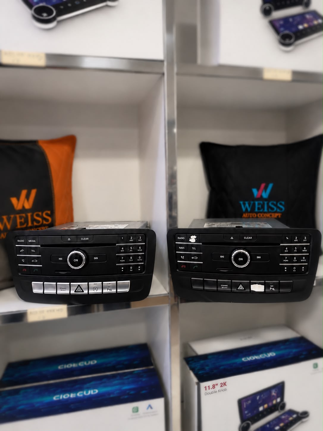 Old and new Mercedes CLA250 head units side by side at Weiss Auto Concept Dubai