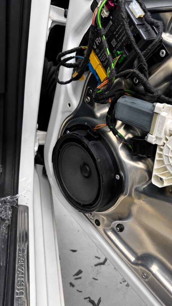 Worn factory speaker removed from a Mercedes E-Class door in Dubai