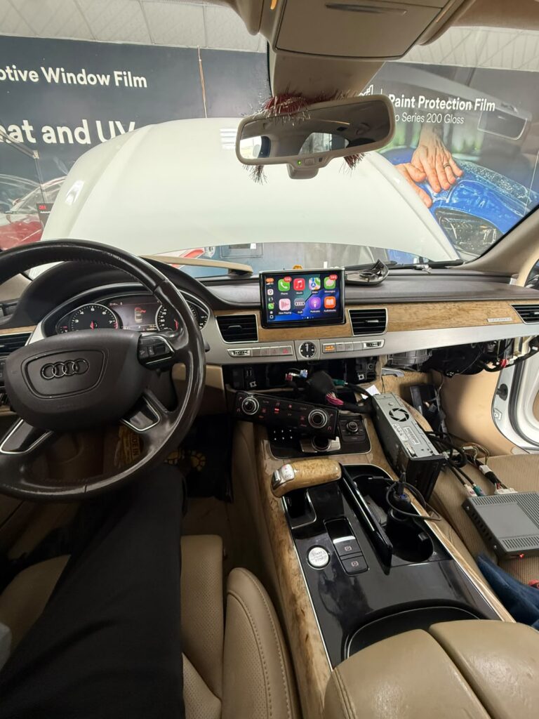 Interior dashboard and cabin of a 2012 Audi A8 during multimedia upgrade at Weiss Auto Concept Dubai