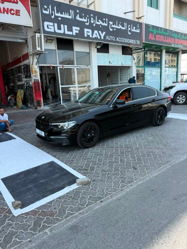 Black BMW 5 Series G30 at Weiss Auto Concept Dubai workshop after 360 degree camera installation