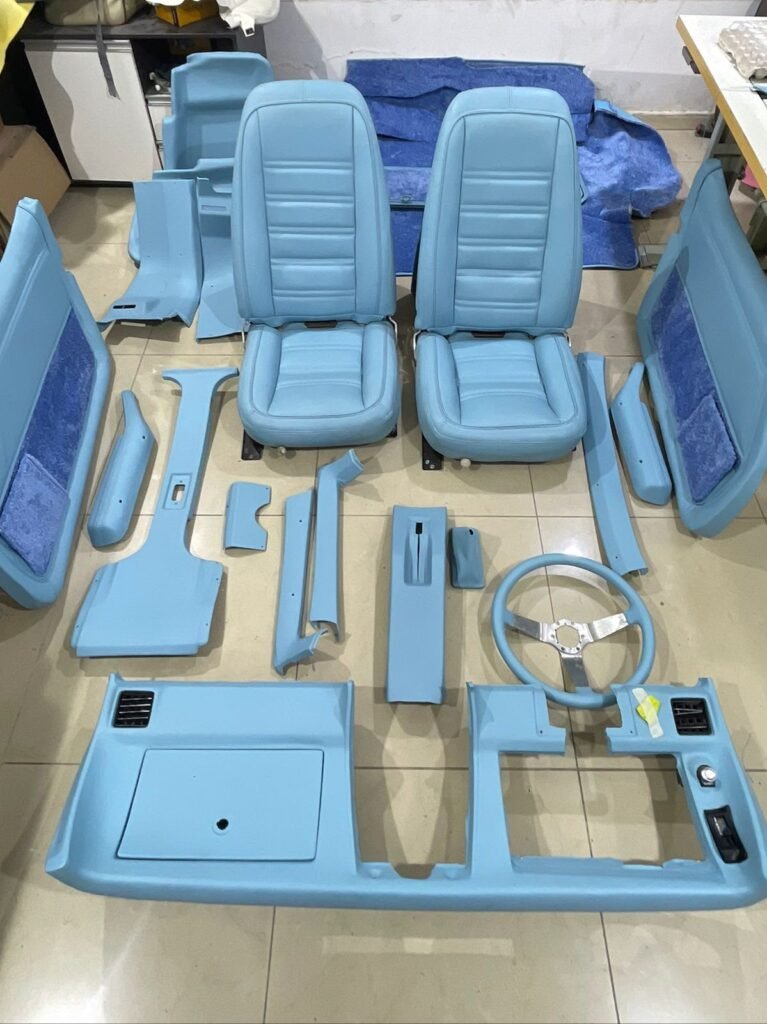 Full set of custom blue restored interior panels and seats for a classic Corvette C3
