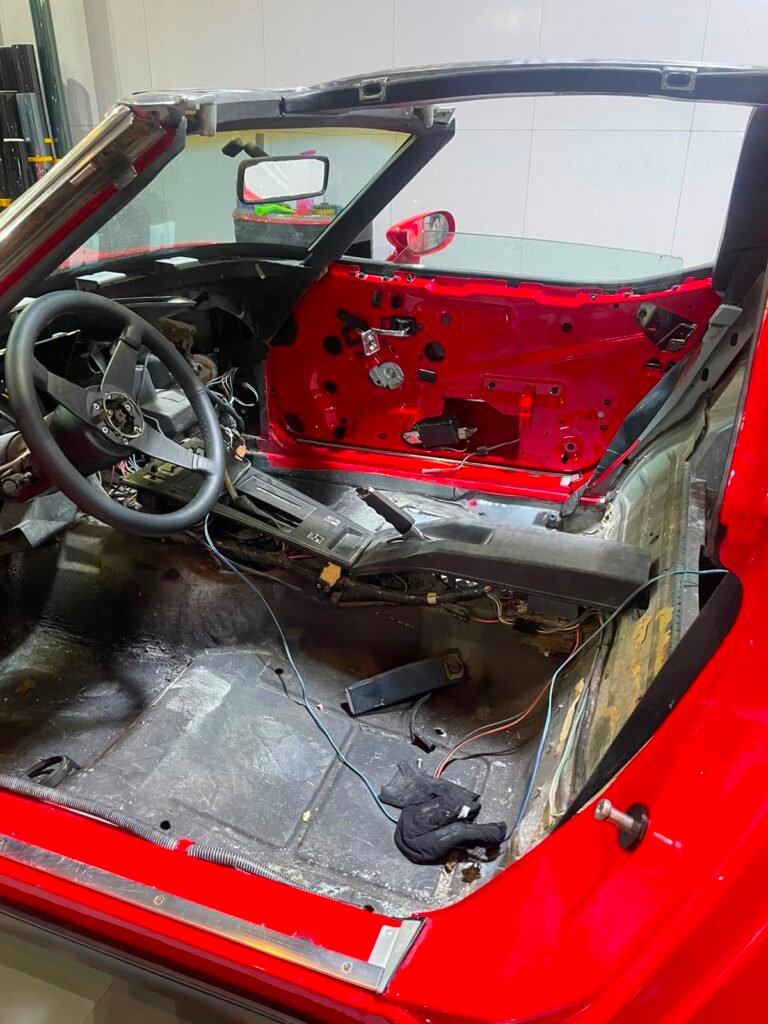 Stripped Corvette C3 cabin before interior restoration at Weiss Auto Concept Dubai