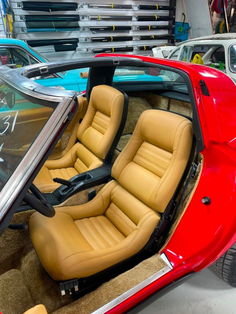 Restored tan leather seats in a classic Corvette C3 by Weiss Auto Concept Dubai