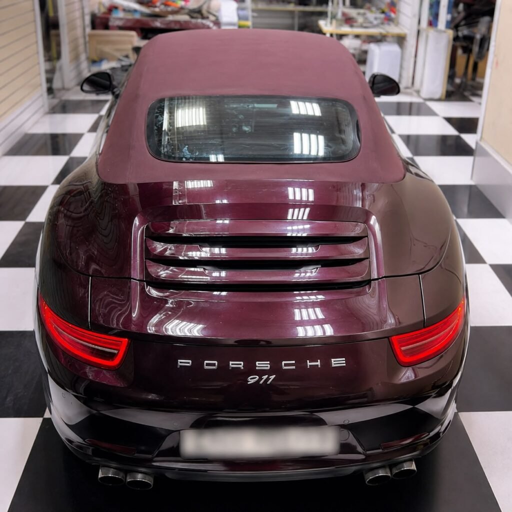 Rear view of Porsche 911 Cabriolet after soft top replacement at Weiss Auto Concept Dubai