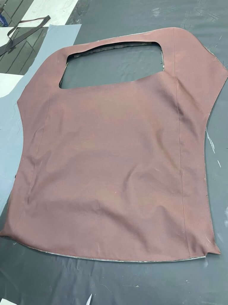 New Porsche 911 soft top fabric measured and cut by hand in Dubai