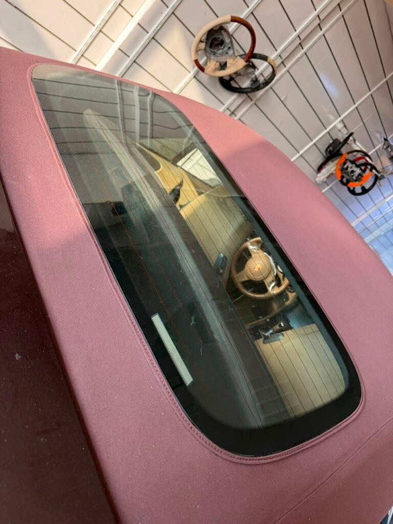 Finished Porsche 911 soft top rear glass with clean seam and no visible silicone