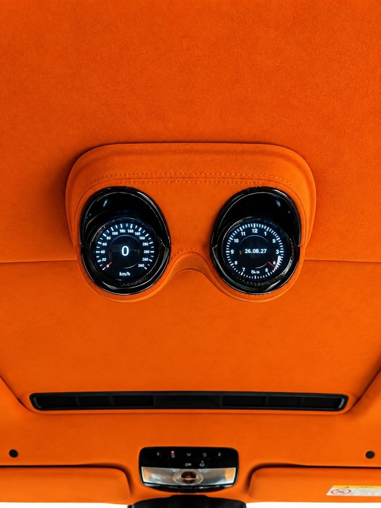 Roof instrument cluster trimmed in orange Alcantara installed in a 2022 Mercedes-AMG G63 in Dubai