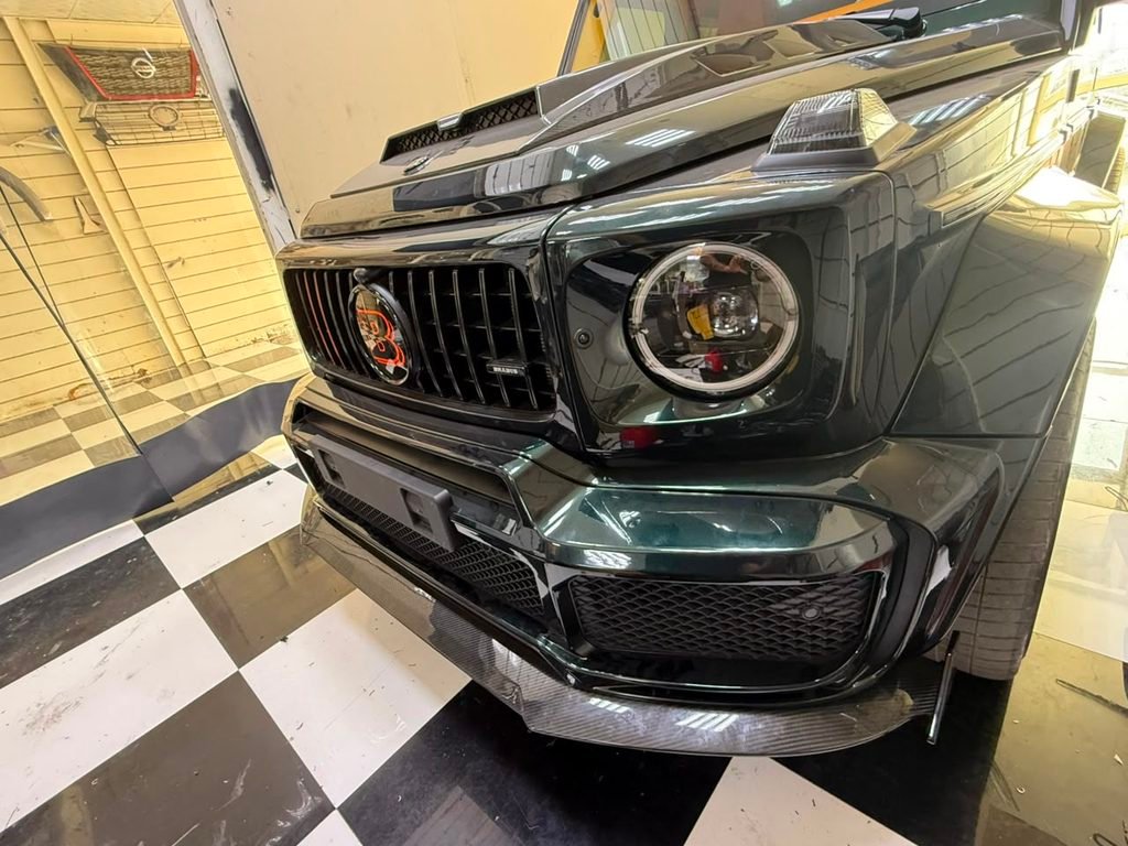 Brabus-style carbon front bumper lip fitted to a 2022 Mercedes-AMG G63 in Dubai by Weiss Auto Concept
