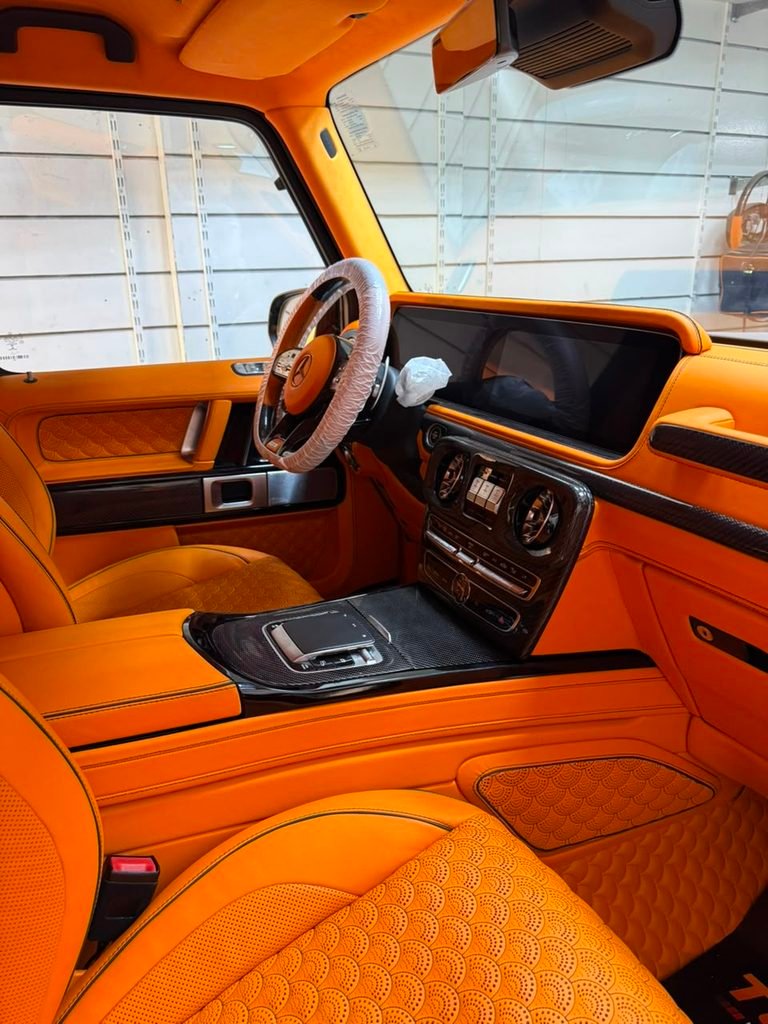 W465-style touchpad installed on the carbon centre console of a 2022 Mercedes-AMG G63 in Dubai by Weiss Auto Concept
