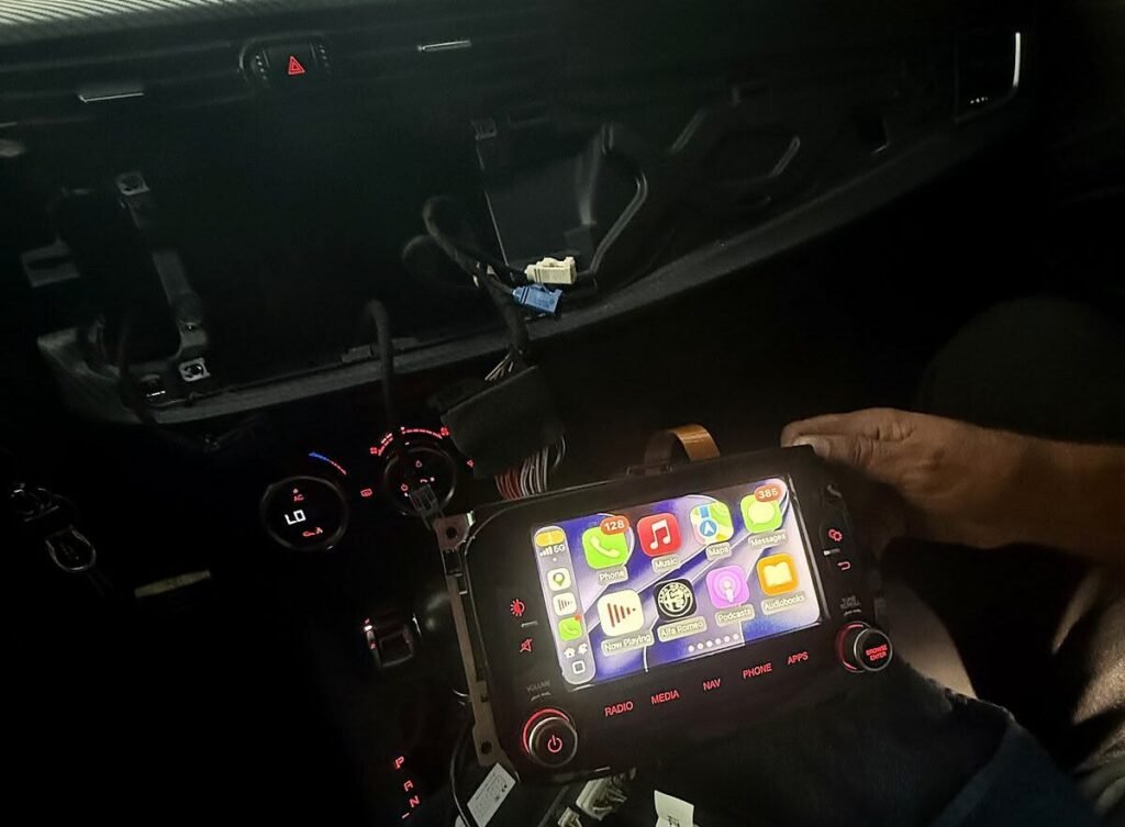 Alfa Romeo Giulietta Uconnect head unit out of the dashboard during Apple CarPlay bench test