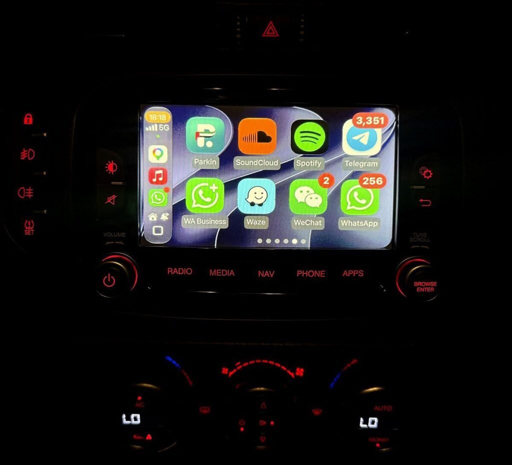 Alfa Romeo Giulietta wireless Apple CarPlay with Waze, WhatsApp and Spotify on the original screen
