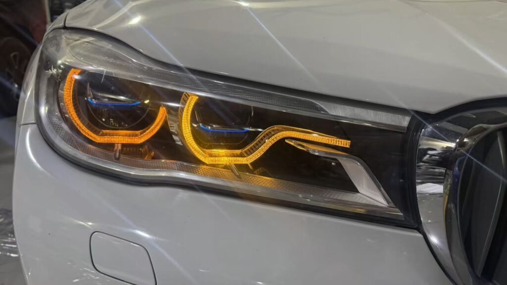 BMW 7 Series headlight with lemon-yellow DRL upgrade at Weiss Auto Concept in Dubai